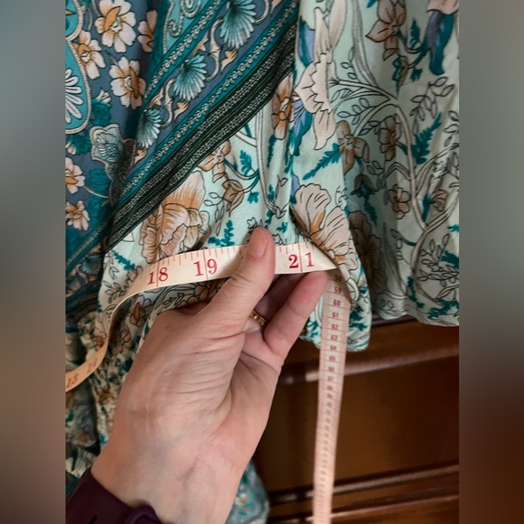 Beautiful BloomChic teal bandana print top with flutter sleeves and a tie belt. - Picture 5 of 7